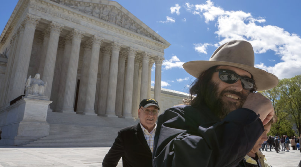 Photo of Erik Brunetti leaving the Supreme Court of the United States after winning his lawsuit about registration of his trademark for his brand